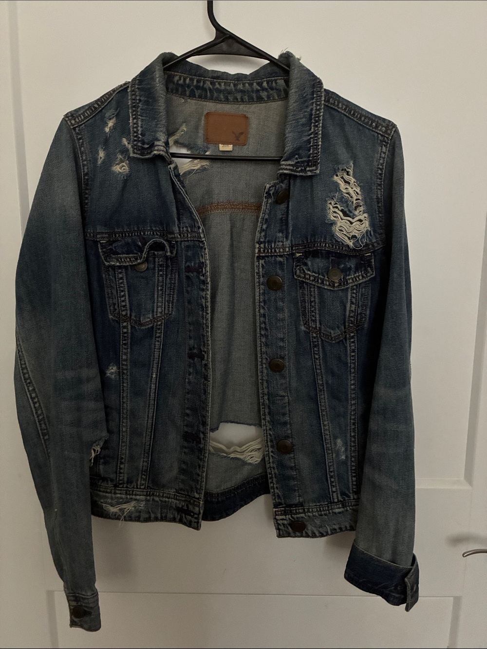 American Eagle Outfitters Light Blue Distressed Denim Jacket with Brown Patch